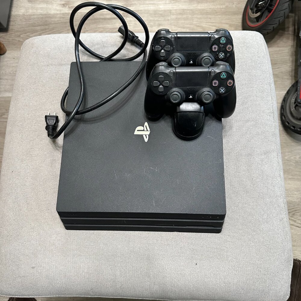 Sony PlayStation 4 Pro (PS4 Pro) Black Video Game Console with 2 Controllers 1TB